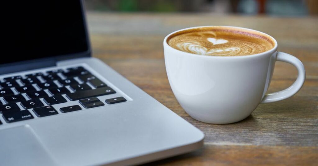 Courses - Teacup of Latte Beside Macbook Pro