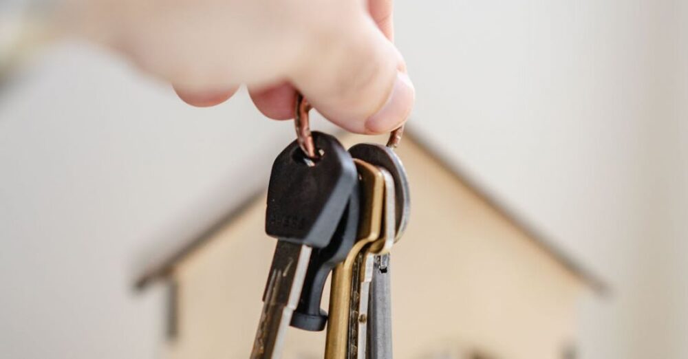 Legal Issues - Person with keys for real estate