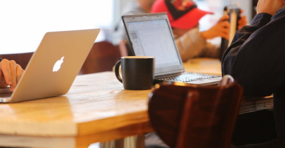 Clients - People Using Laptops While Sitting on Chair