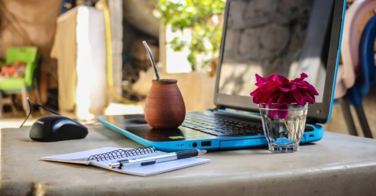 Digital Nomad - White Notebook Beside Blue Laptop Computer