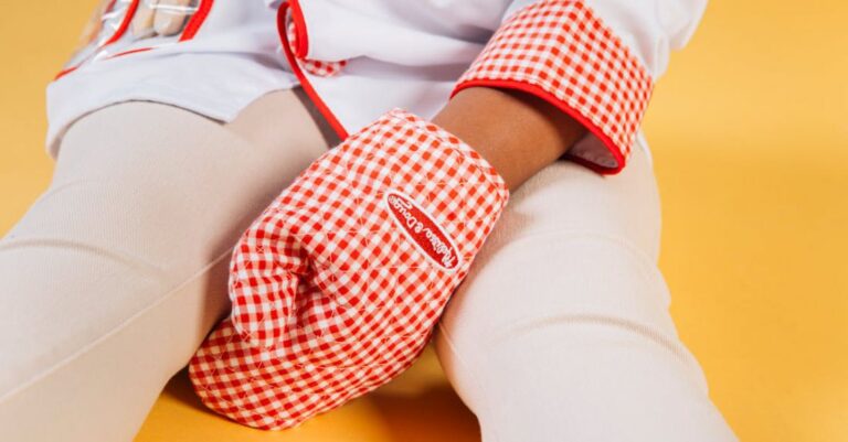 Job Roles - Little child wearing chef uniform with oven glove