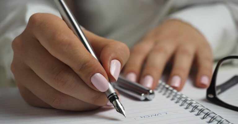 Work Schedules - Woman in White Long Sleeved Shirt Holding a Pen Writing on a Paper