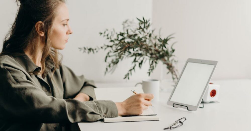 Productivity - Woman in Gray Coat Using White Laptop Computer