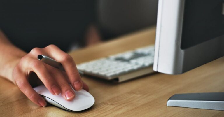 Jobs - Person Holding Apple Magic Mouse